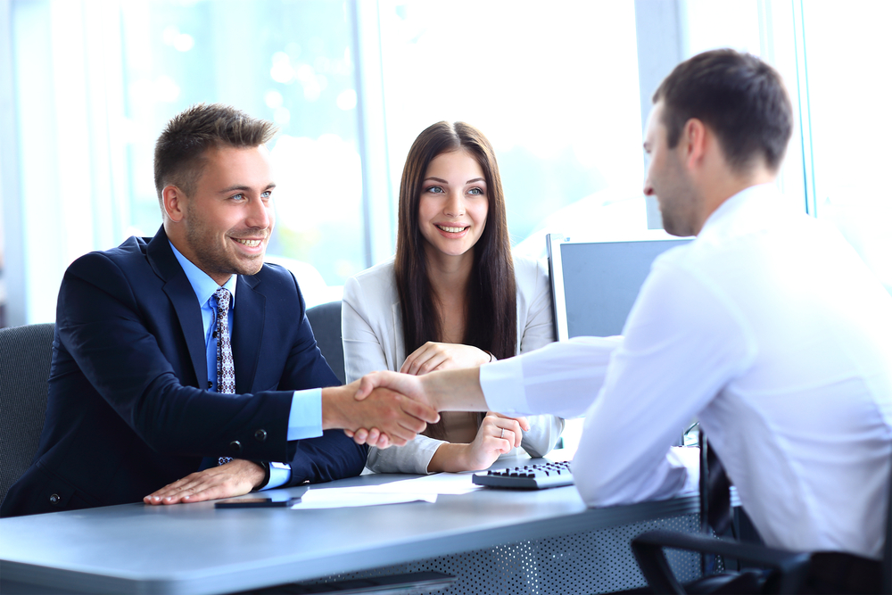 Businessman,Shaking,Hands,To,Seal,A,Deal,With,His,Partner